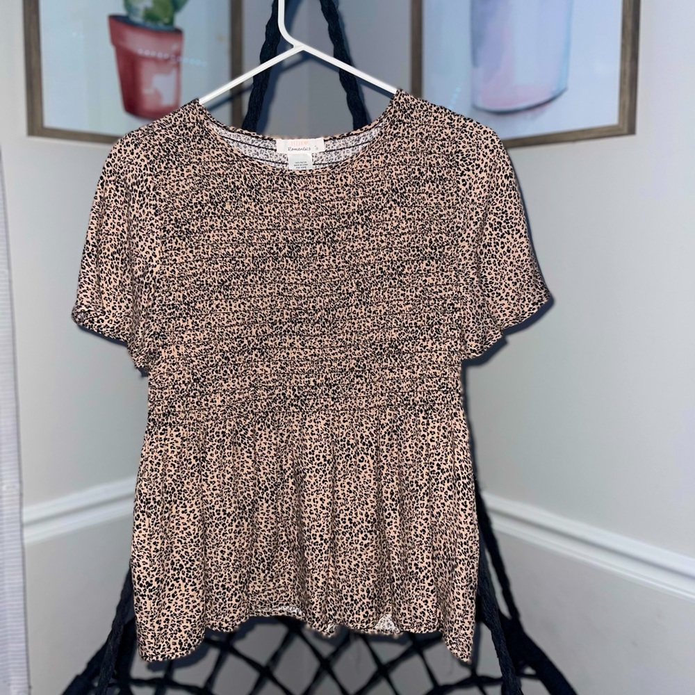 This a chetah print shirt brand new never worn in a small